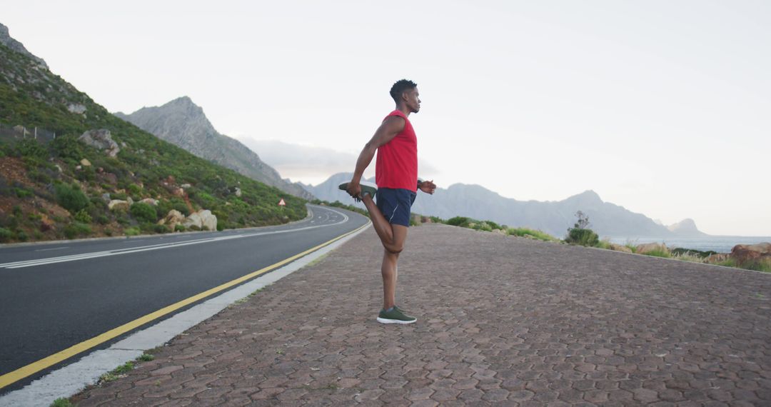 African American Man Stretching Before Outdoor Run in Scenic Nature - Free Images, Stock Photos and Pictures on Pikwizard.com