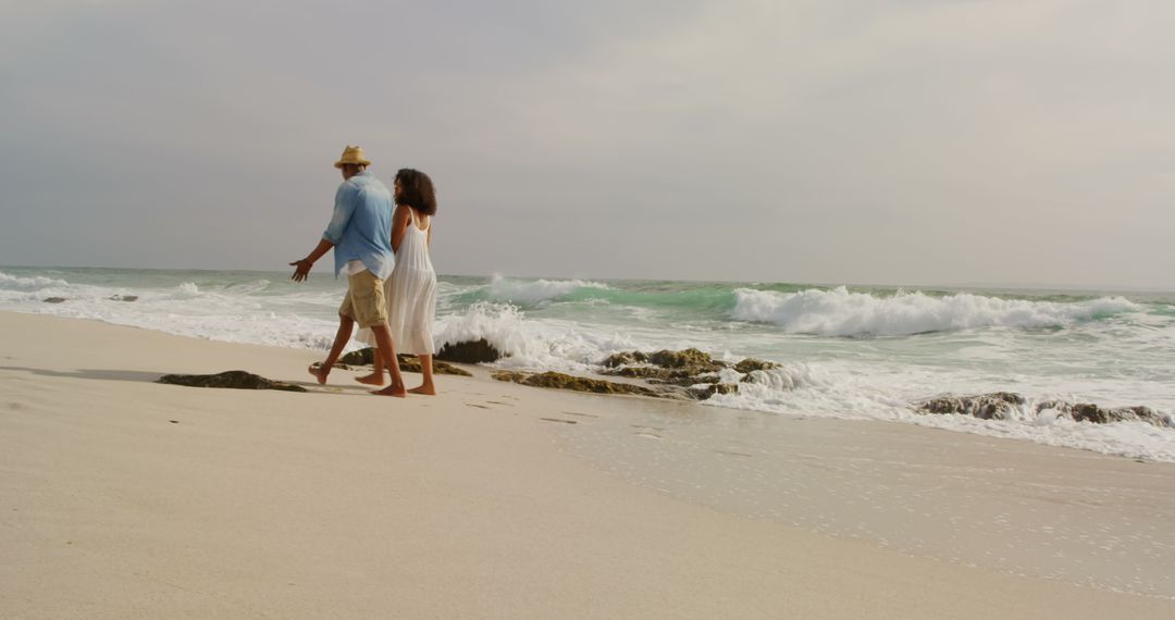 Romantic Couple Strolling on Seaside at Sunset