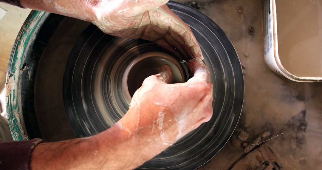 Close-up of Potter's Hands Shaping Clay on Spinning Wheel - Free Images, Stock Photos and Pictures on Pikwizard.com