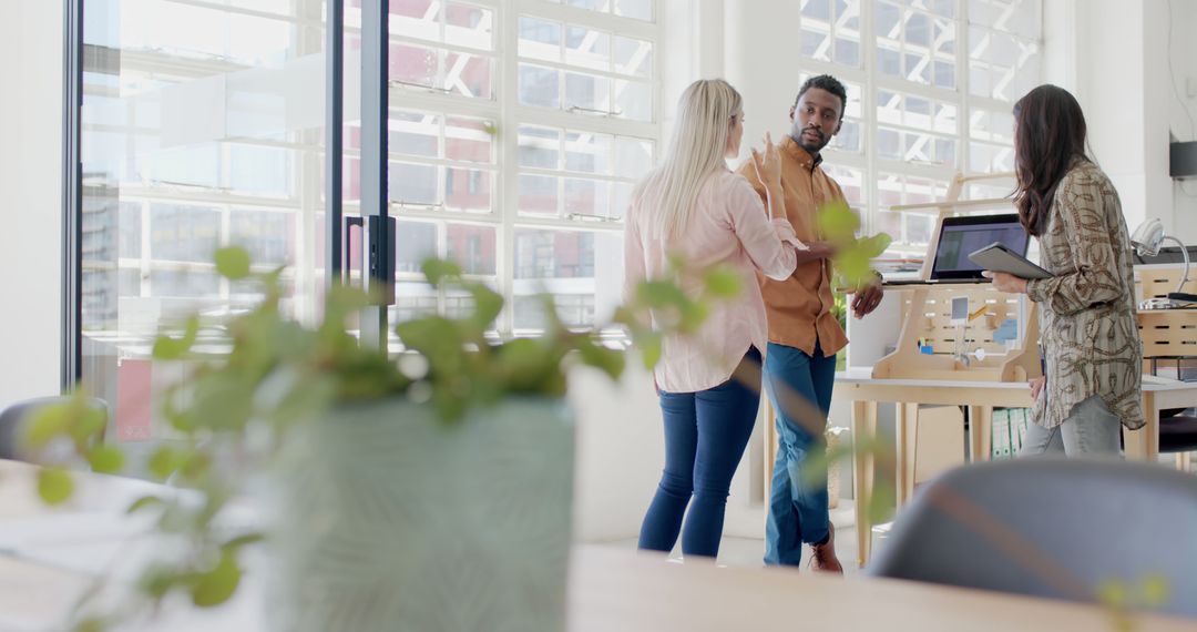 Diverse Team Collaborative Meeting in Modern Office Space