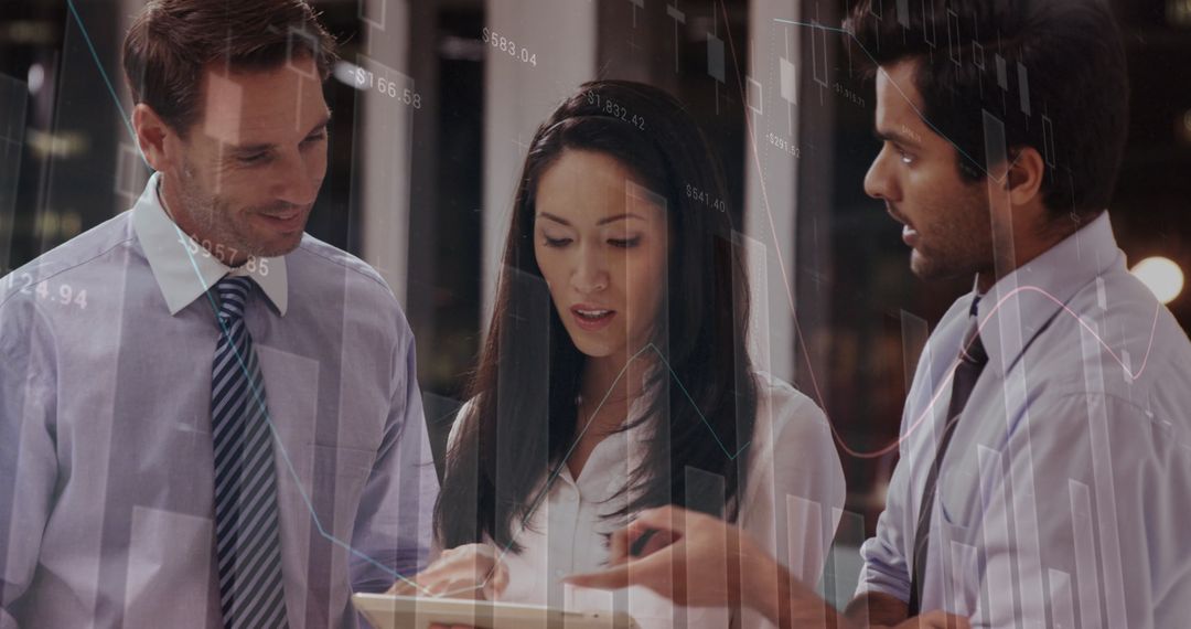 Diverse Business Team Analyzing Data on Tablet