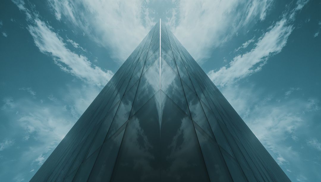 Futuristic Glass Skyscraper Reflecting Cloudy Sky