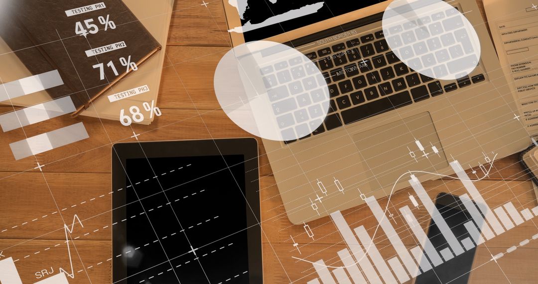 Analyzing Financial Data on Laptop and Tablet for Business Strategy