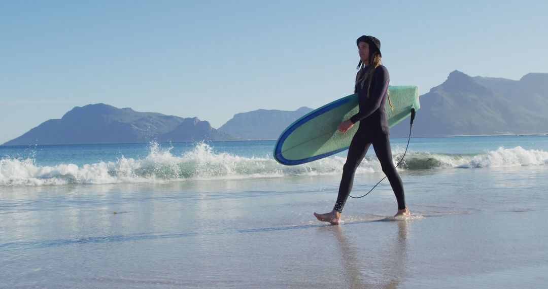 Young Woman Walking on Beach with Surfboard at Sunrise - Free Images, Stock Photos and Pictures on Pikwizard.com