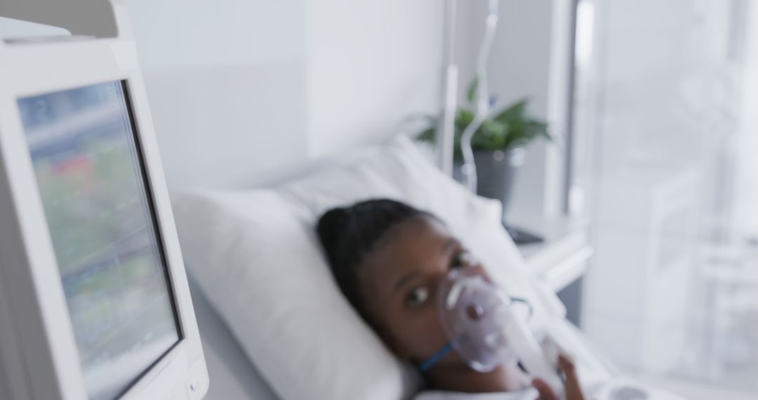 Patient on Hospital Bed with Oxygen Mask - Free Images, Stock Photos and Pictures on Pikwizard.com