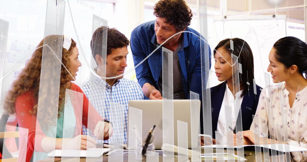 Diverse Team Analyzing Financial Data with Laptop and Charts