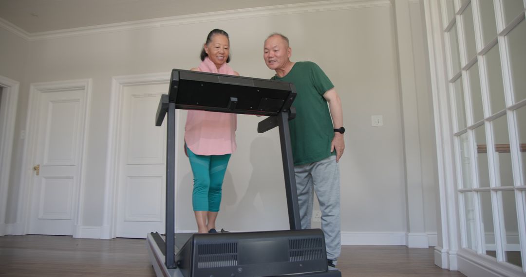 Senior Couple Enjoying Treadmill Exercise at Home Gym