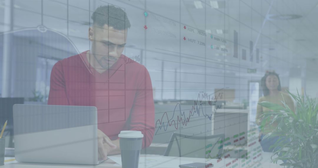 Focused Businessman Analyzing Data with Graphs Overlay