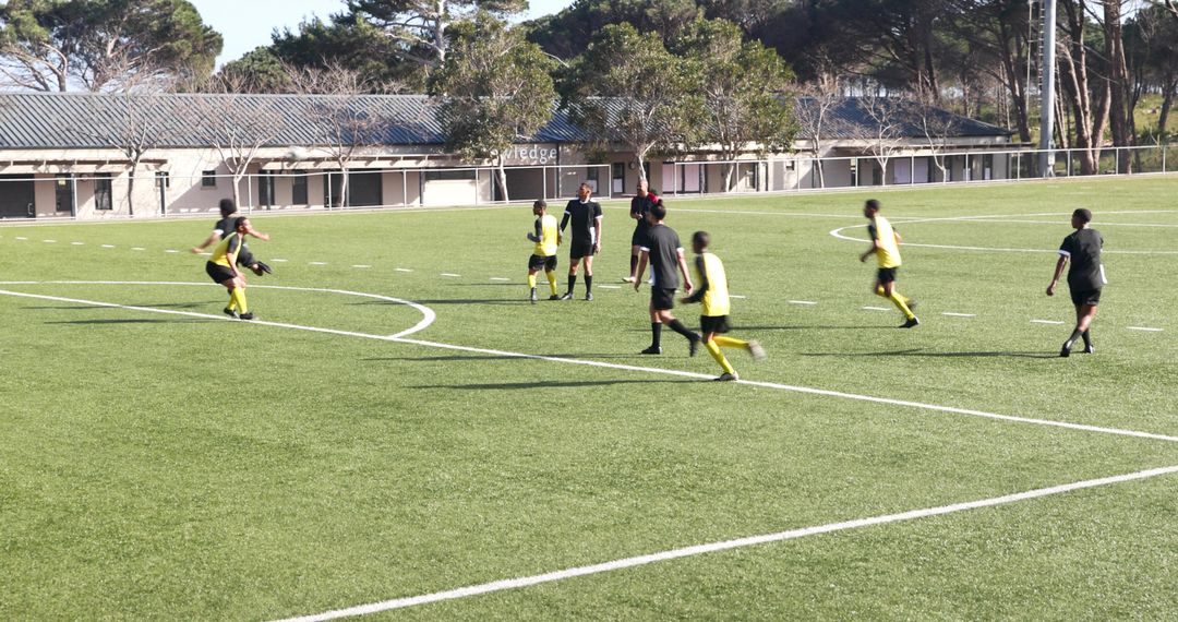 Dynamic Soccer Match on Outdoor Field Showcasing Teamwork