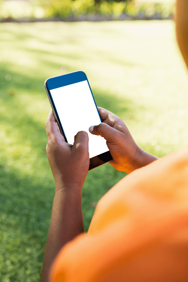 Using Smartphone in Park with Calming Green Background