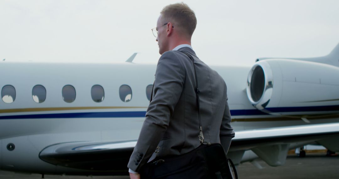 Businessman Boarding Private Jet for Corporate Travel - Free Images, Stock Photos and Pictures on Pikwizard.com