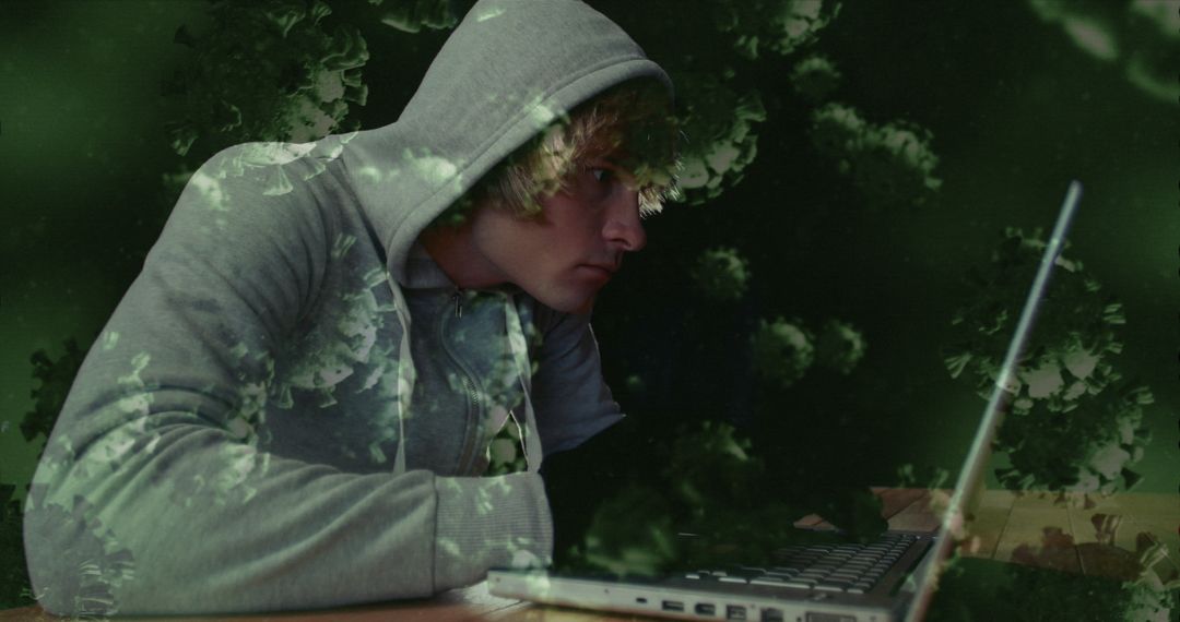Mysterious Hacker in Hoodie Amid Digital Virus Symbols