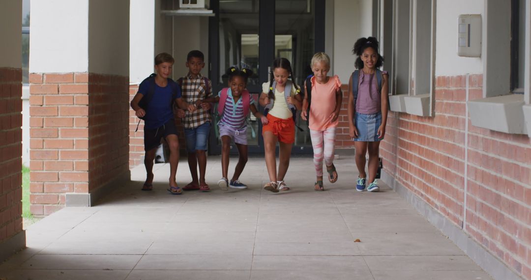 Happy Diverse Children Returning to School Corridor