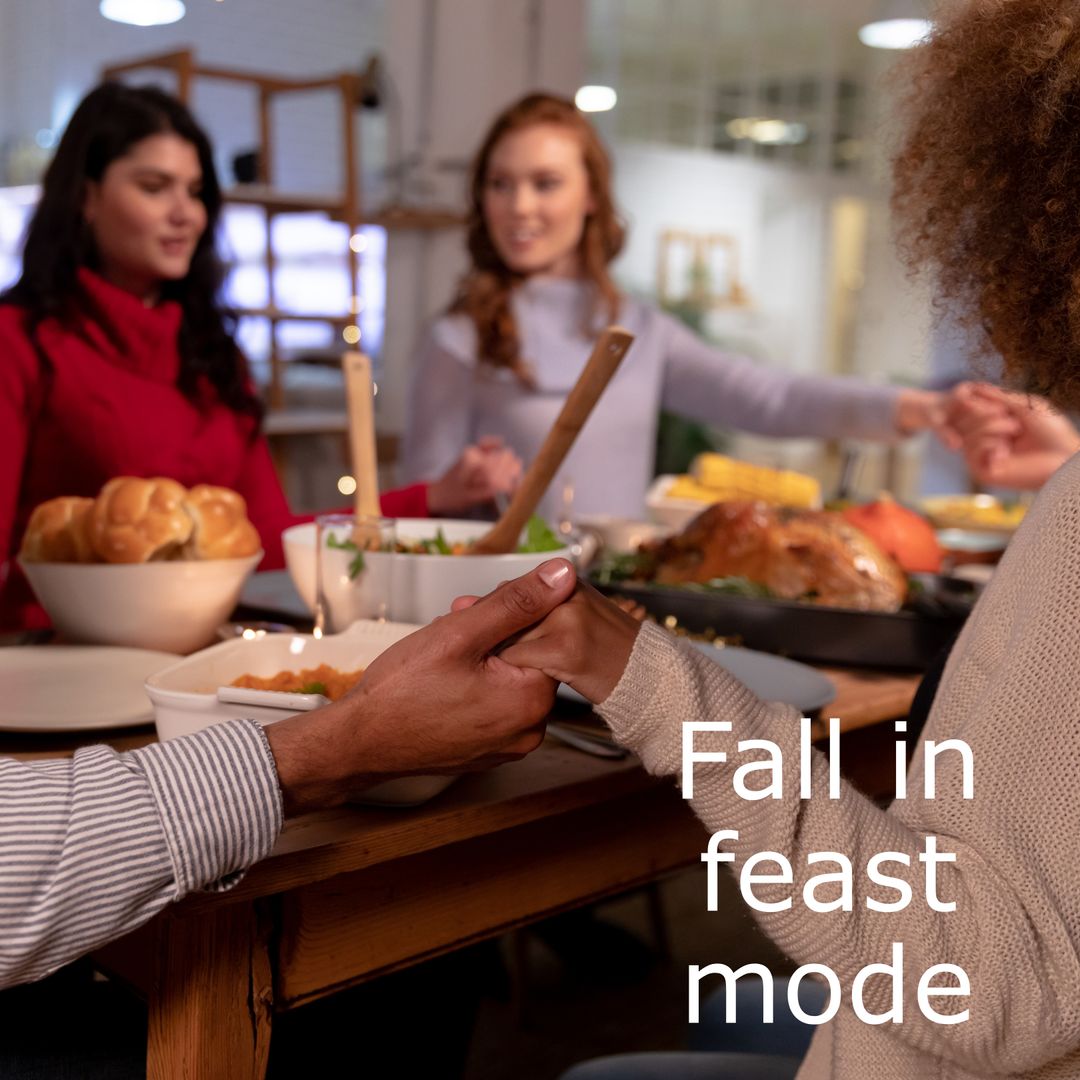 Friends Celebrating Thanksgiving Dinner Together With Joy