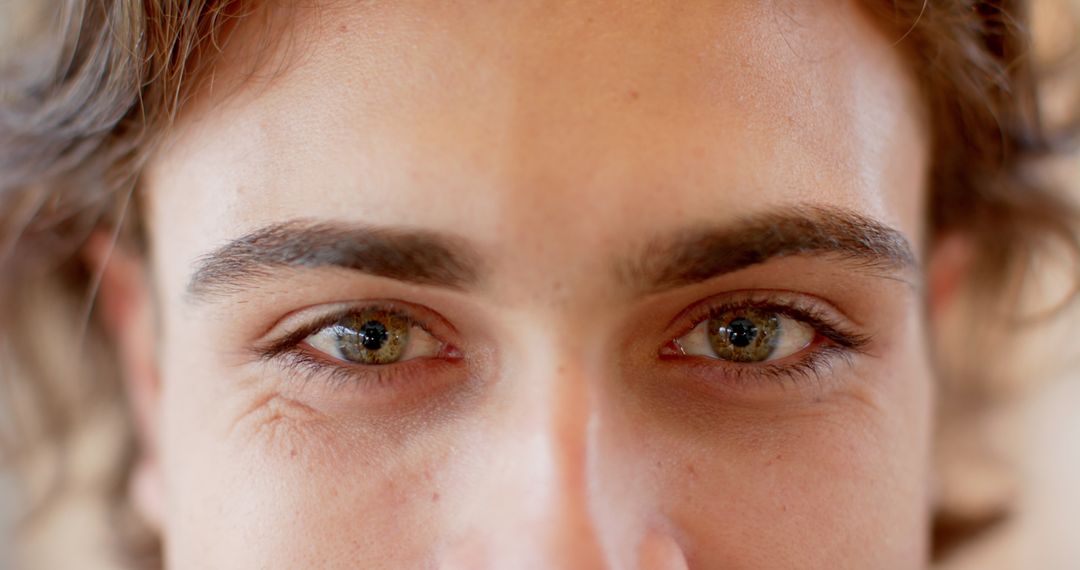 Close-Up Portrait Highlighting Green Eyes and Freckles