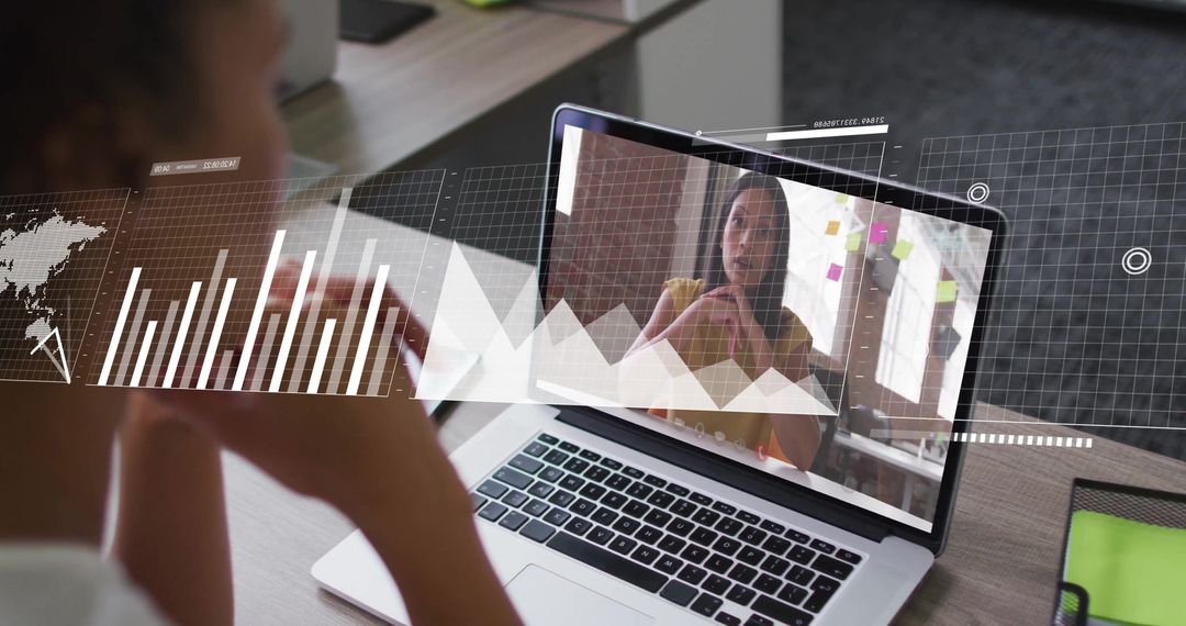 Virtual Meeting Amidst Financial Data Analysis on Laptop Screen