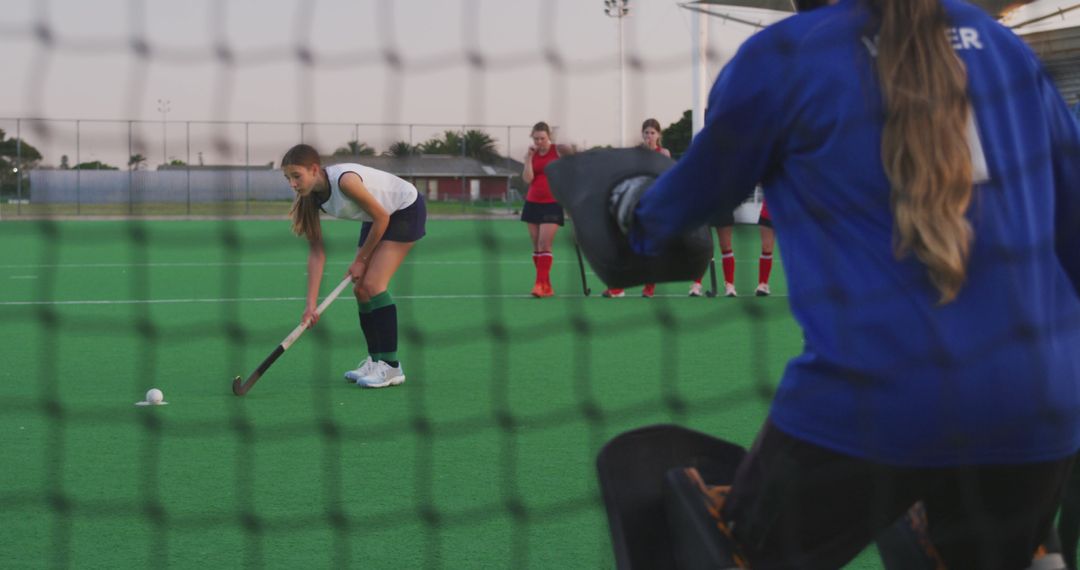 Female Field Hockey Player Preparing for Penalty Shot During Match - Free Images, Stock Photos and Pictures on Pikwizard.com