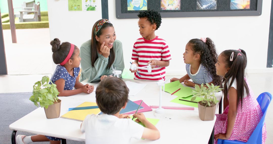 Elementary Teacher Engaging With Students in Classroom Discussion