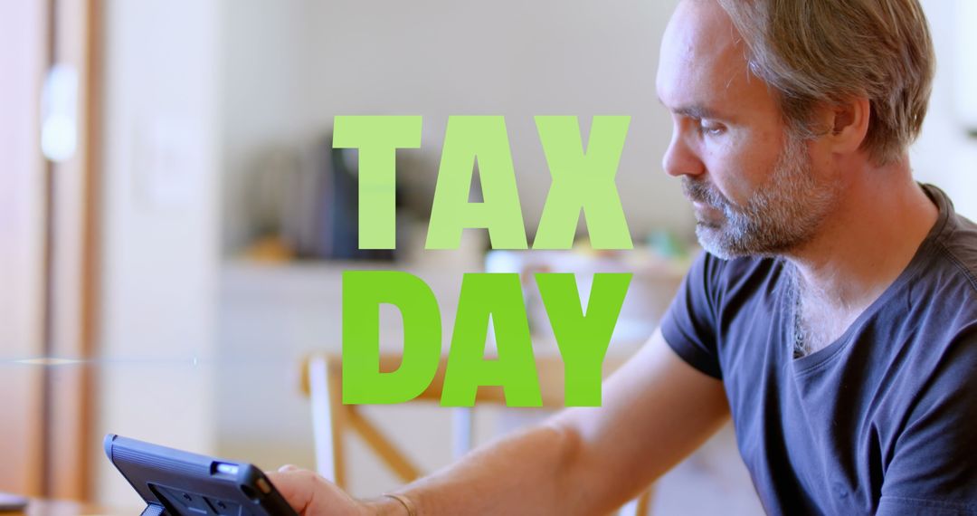 Focused Middle-Aged Man Calculating Taxes on Tax Day