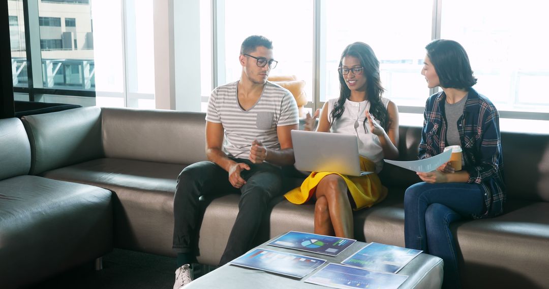 Young professionals collaborating in modern office open space