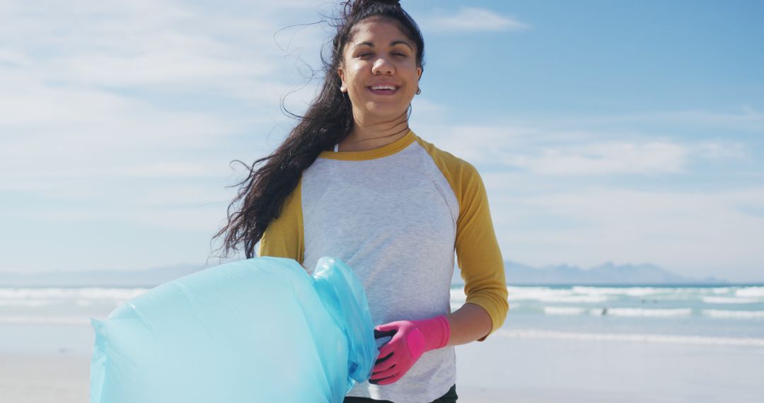 Young Woman Volunteering Beach Cleanup On Sunny Day - Free Images, Stock Photos and Pictures on Pikwizard.com