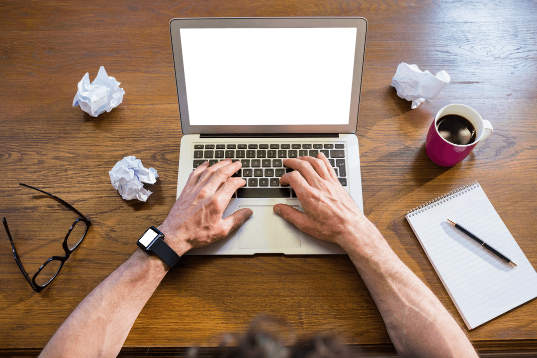 Transparently Working on a Laptop with Coffee and Notes in Office