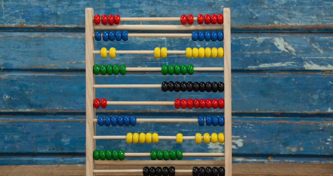 Colorful Wooden Abacus for Math Education on Rustic Background