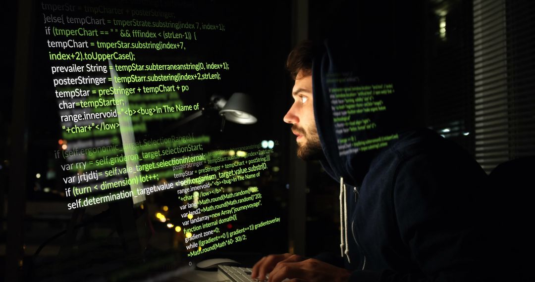 Focused Male Hacker Analyzing Data at Night