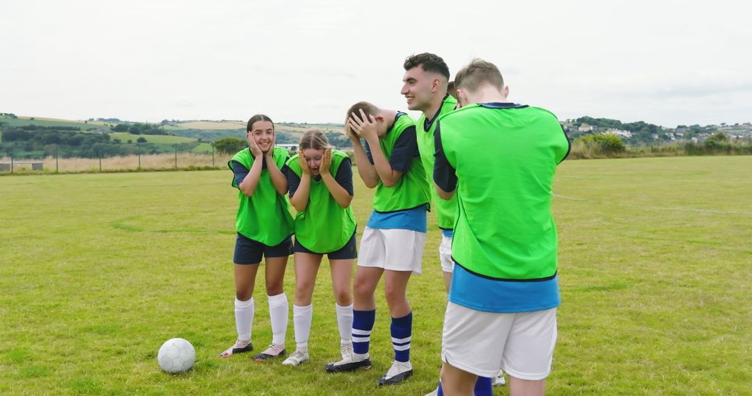 Soccer Players Bracing for Free-Kick on Field