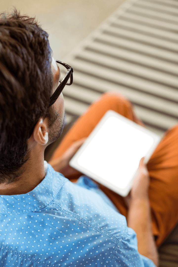 Business Executive Using Transparent Screen Tablet in Office