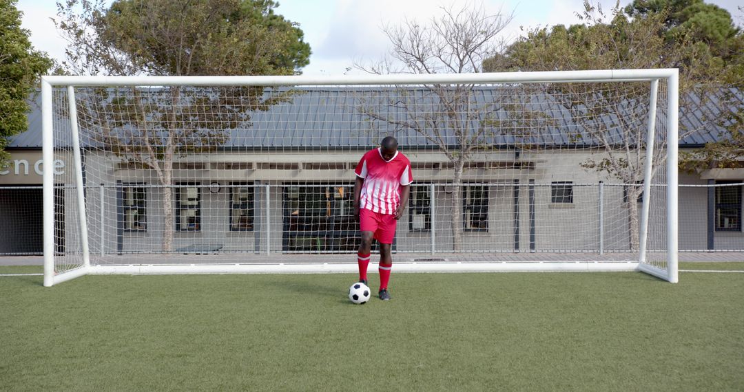 Soccer Player Balancing Ball with Precision on Field