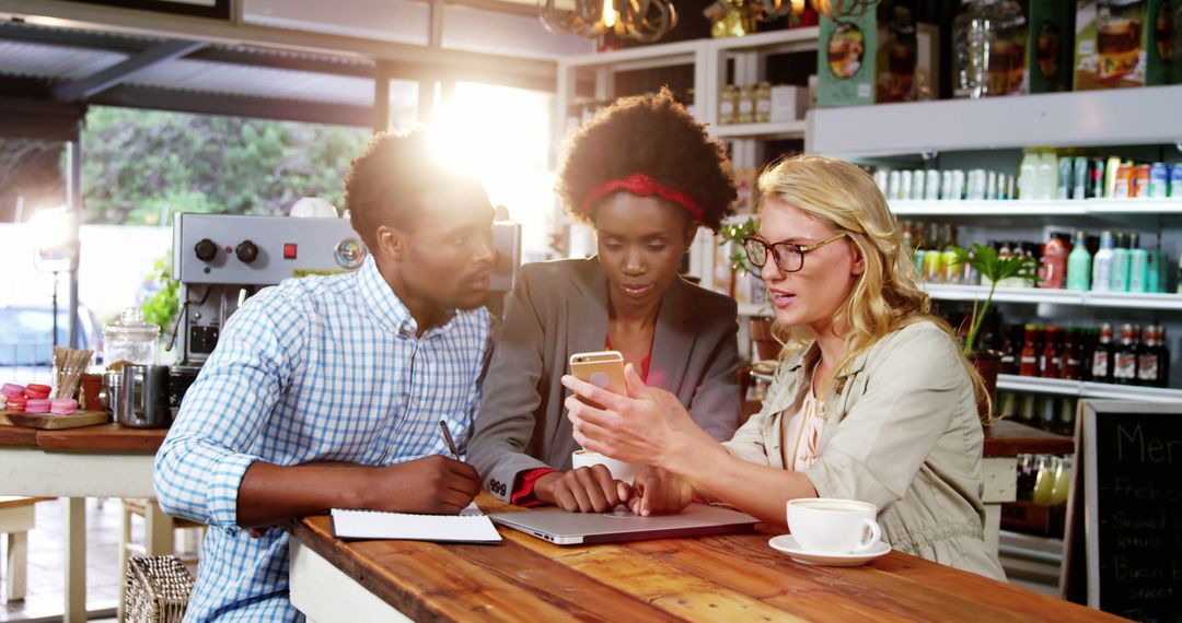 Collaborative Business Meeting in Cozy Cafe Setting