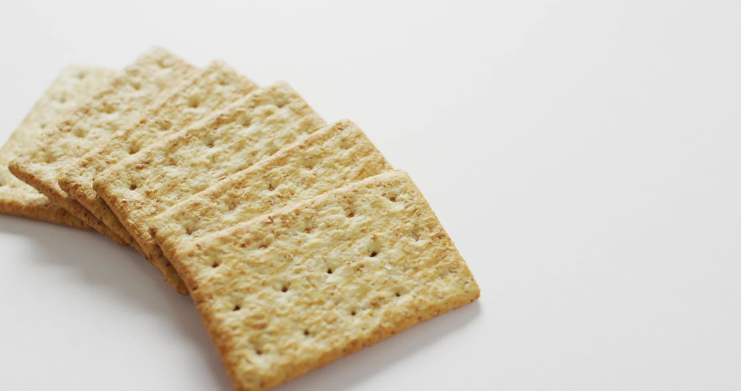 Close-up of Array of Plain Wheat Crackers on White Background - Free Images, Stock Photos and Pictures on Pikwizard.com