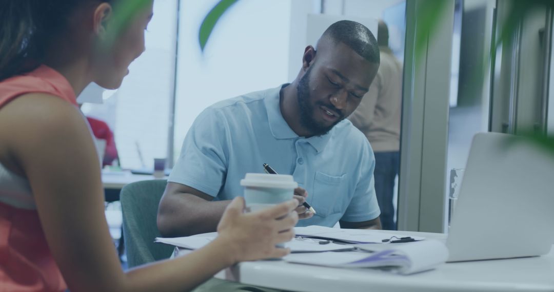 Diverse Team Working on Financial Data and Strategy in Modern Office