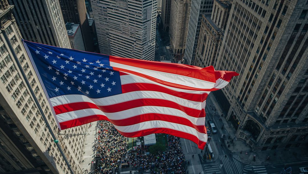 American Flag Flying over Bustling Urban Street with Skyscrapers