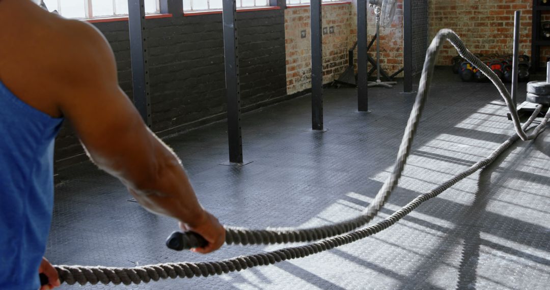 Athletic Man Training with Battle Ropes in Gym - Free Images, Stock Photos and Pictures on Pikwizard.com