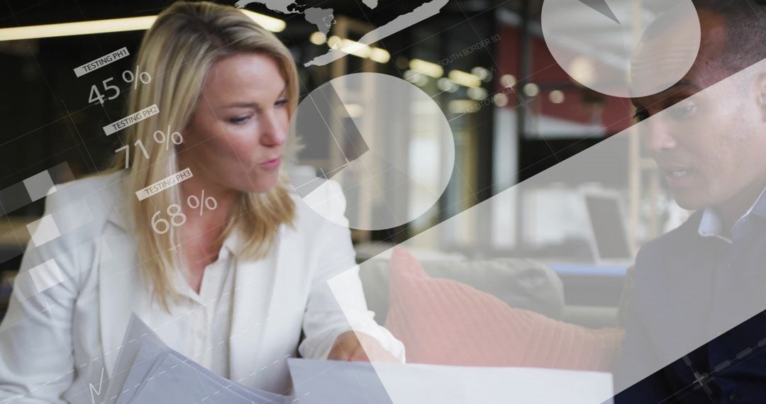 Business Colleagues Analyzing Graphs and Reports in Modern Office