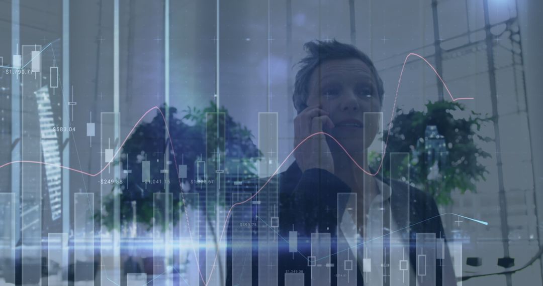 Businesswoman Analyzing Financial Data While on Phone Call