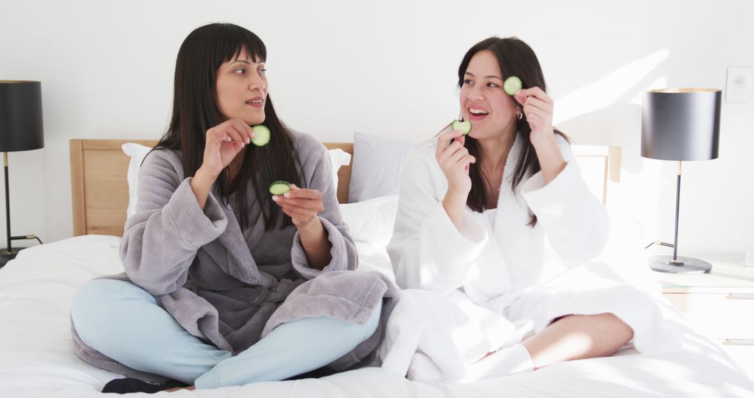 Women Enjoying Relaxing Spa Day at Home with Cucumber Masks - Free Images, Stock Photos and Pictures on Pikwizard.com