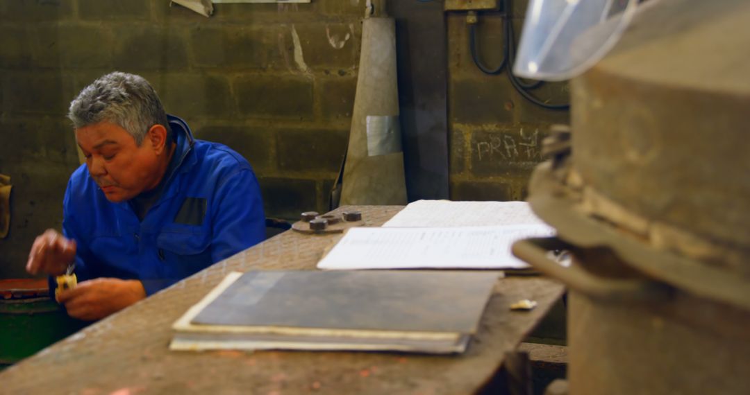 Industrial Worker Engaged in Task in Workshop - Free Images, Stock Photos and Pictures on Pikwizard.com