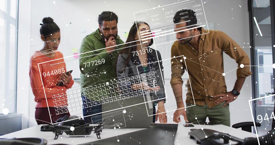 Team reviewing drone prototype with augmented data overlays in modern office collaboration