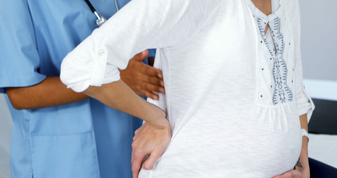 Pregnant Woman Receiving Prenatal Examination by Doctor - Free Images, Stock Photos and Pictures on Pikwizard.com