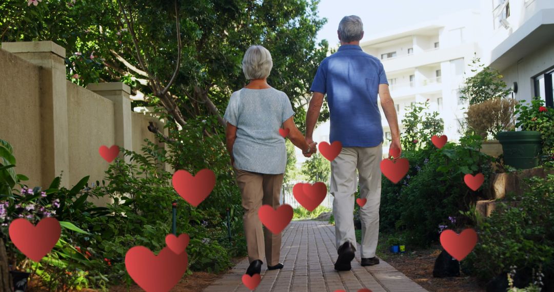 Senior Couple Strolling Along Pathway Surrounded by Hearts