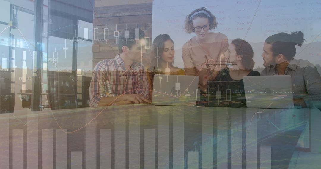 Diverse Business Team Analyzing Financial Data Projection with Laptops