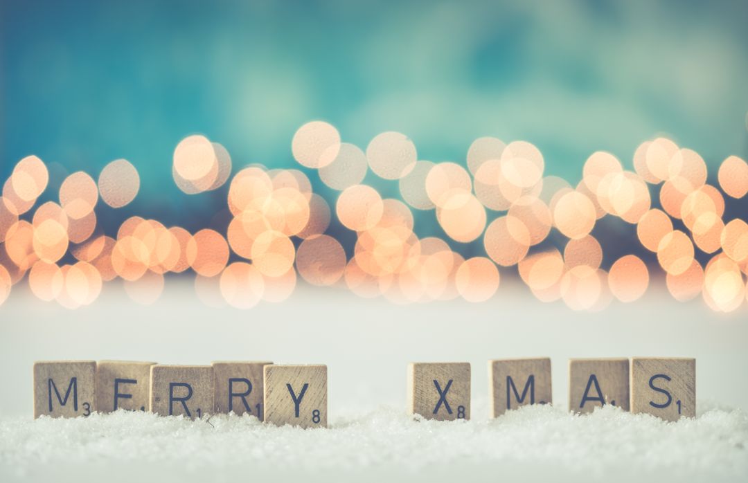 Merry Xmas Holiday Message in Snow with Bokeh Background
