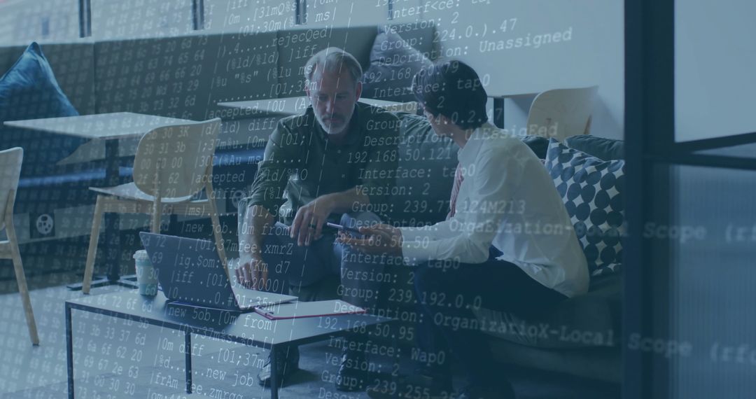 Business Professionals Collaborating on Coding Project in Modern Office