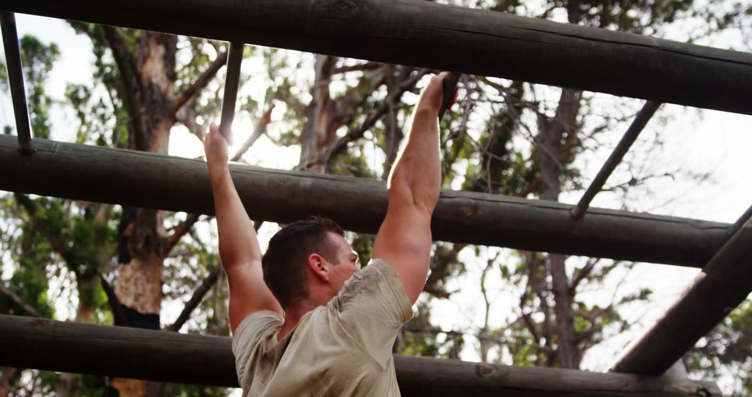 Man Training on Outdoor Obstacle Course Pull-up Bars - Free Images, Stock Photos and Pictures on Pikwizard.com