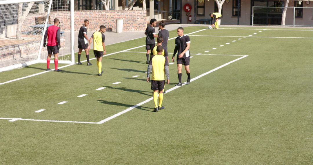 Soccer Players in Before Match Briefing on Sunny Field