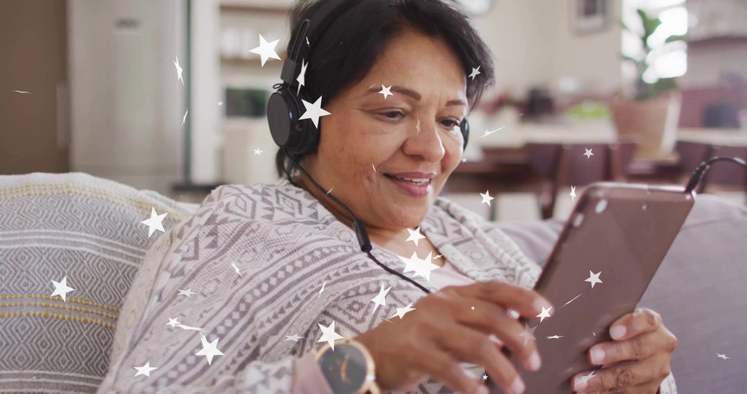Senior Woman Relaxing with Tablet and Headphones at Home