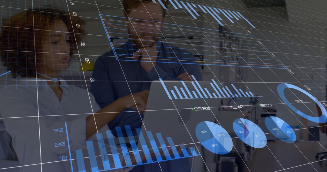 Business Professionals Analyzing Digital Data and Graphs